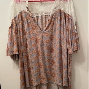 Lace top with the pattern of blue and beige.